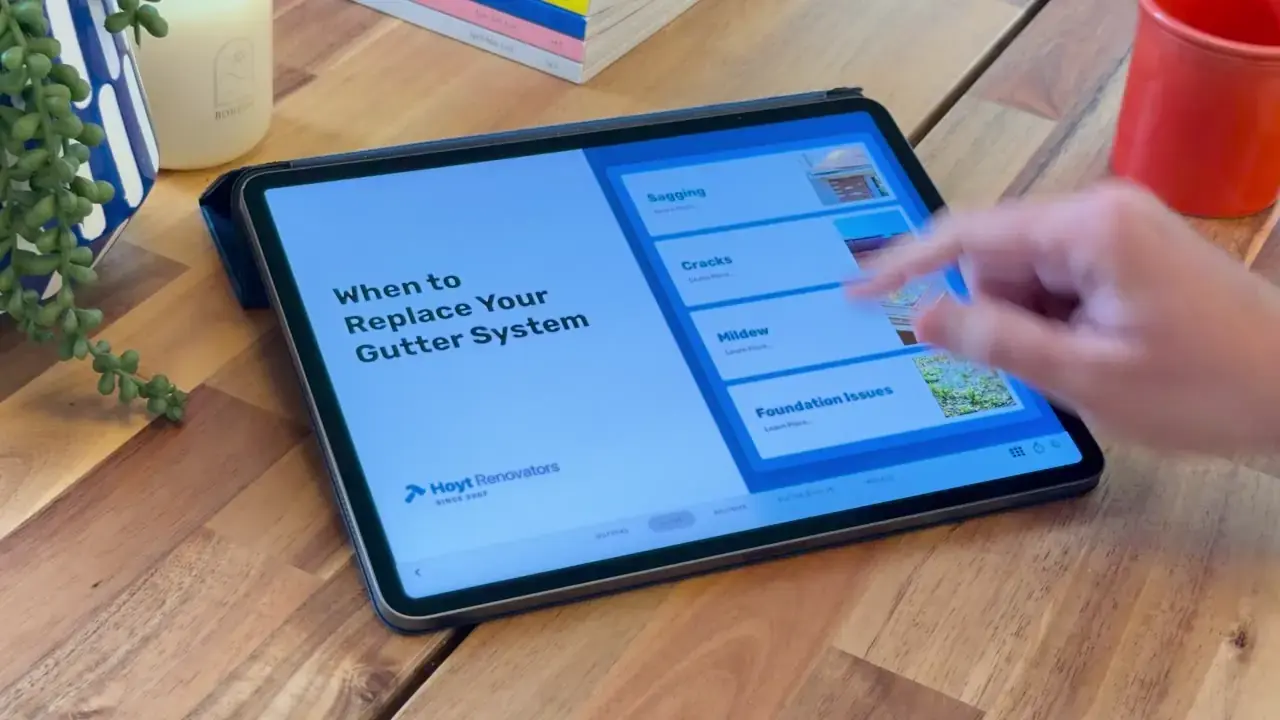 An Ingage gutters presentation open on an iPad at a homeowner's kitchen table.